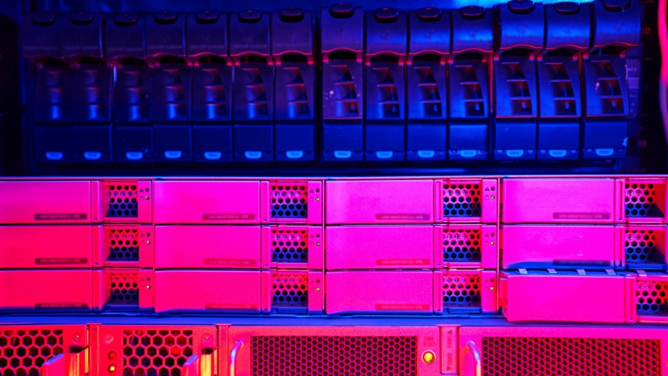 Close up picture of storage server with many HDD disks inside rack in server room